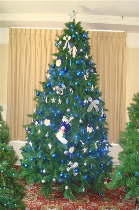 9ft artificial Noble fir decorated in Blue snd silver
